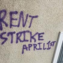 Words Rent Strike April 1st scrawled on a wall