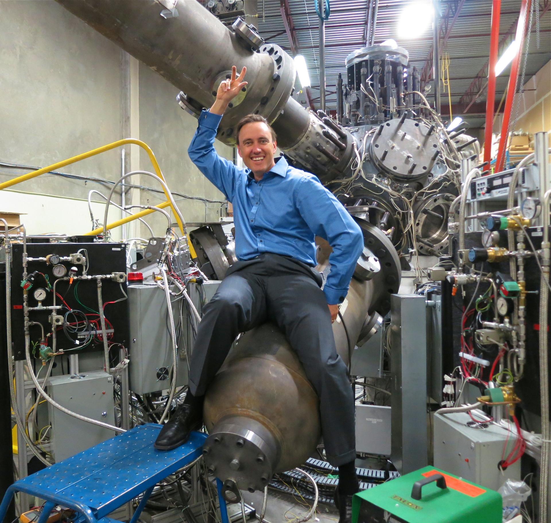 Steam punk fusion man riding what looks like a bomb but is in laboratory 