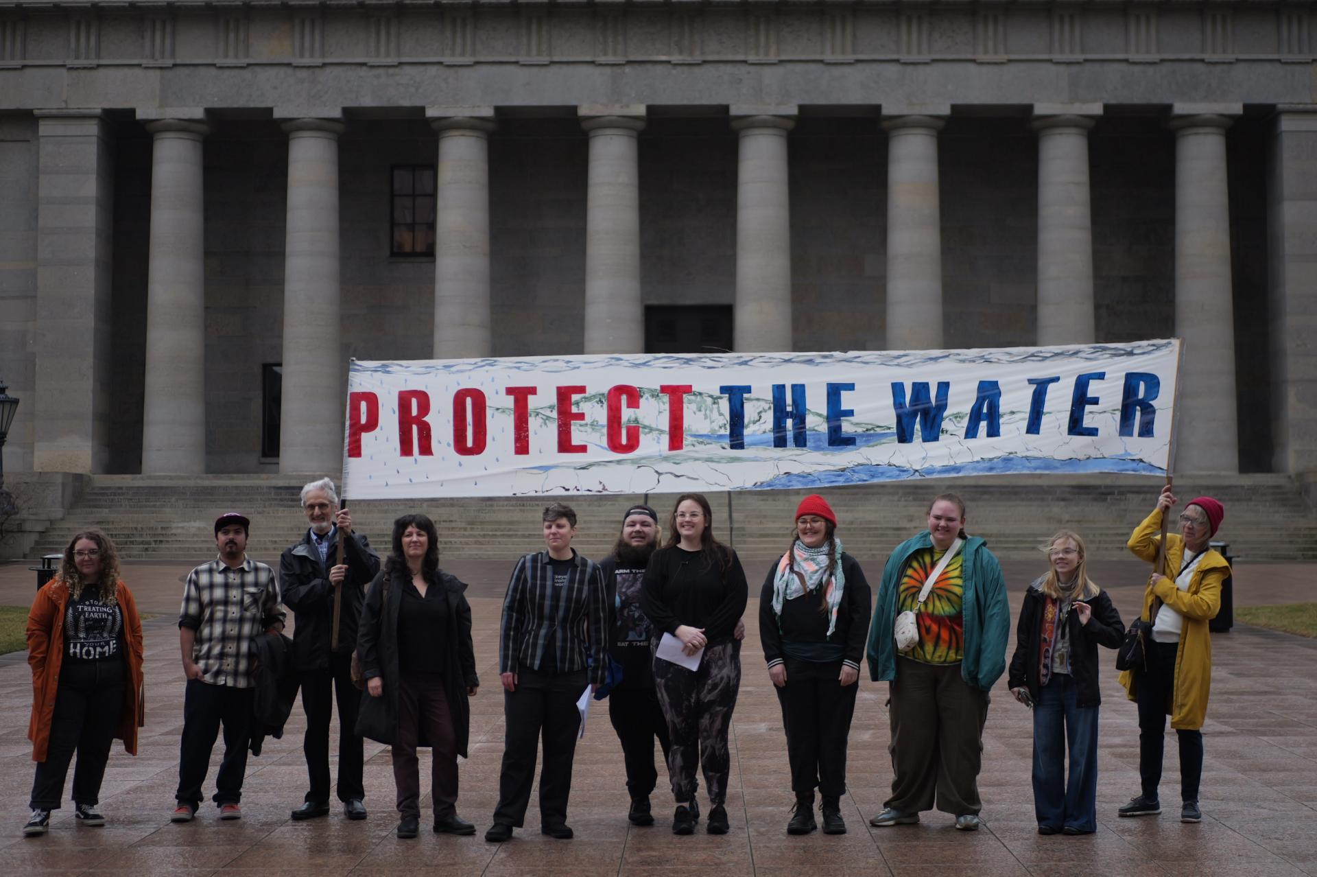 Protesters holding banner