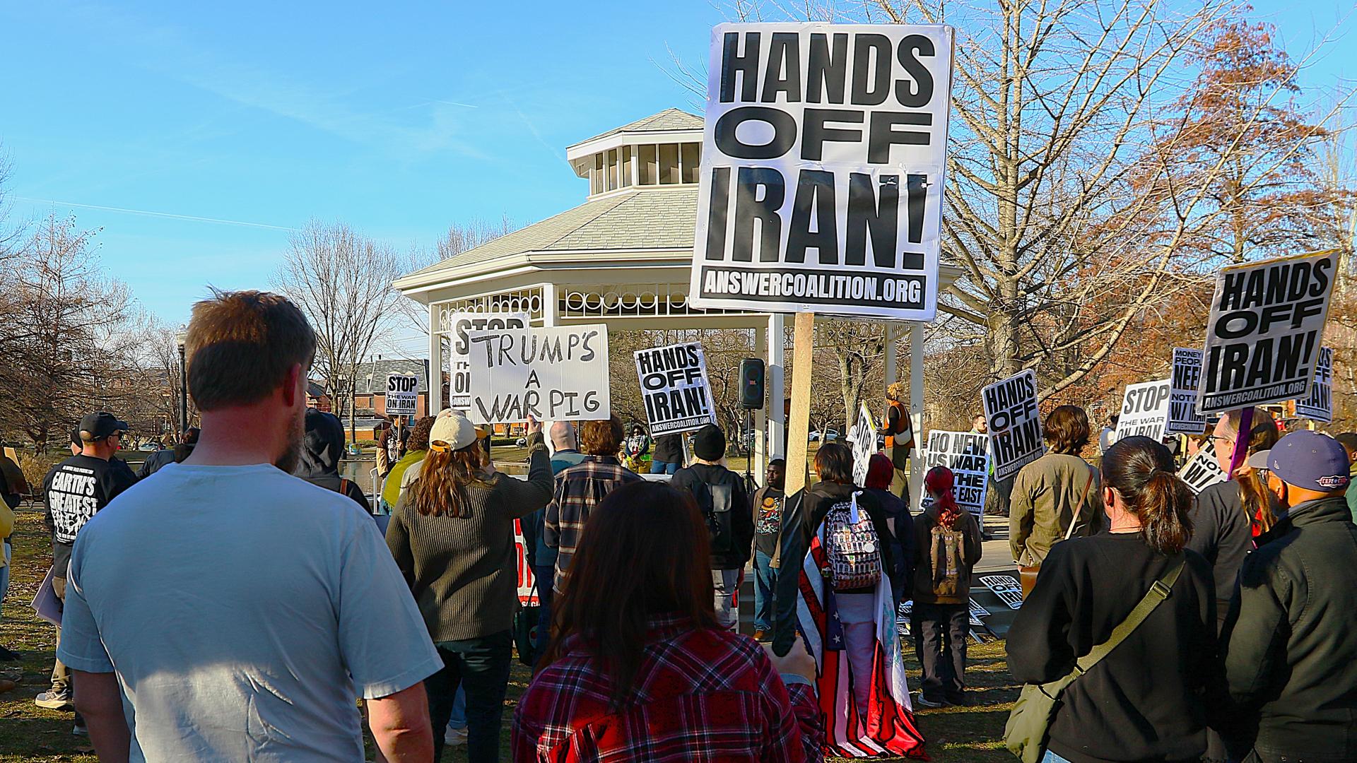 Hands off Iran sign at protest
