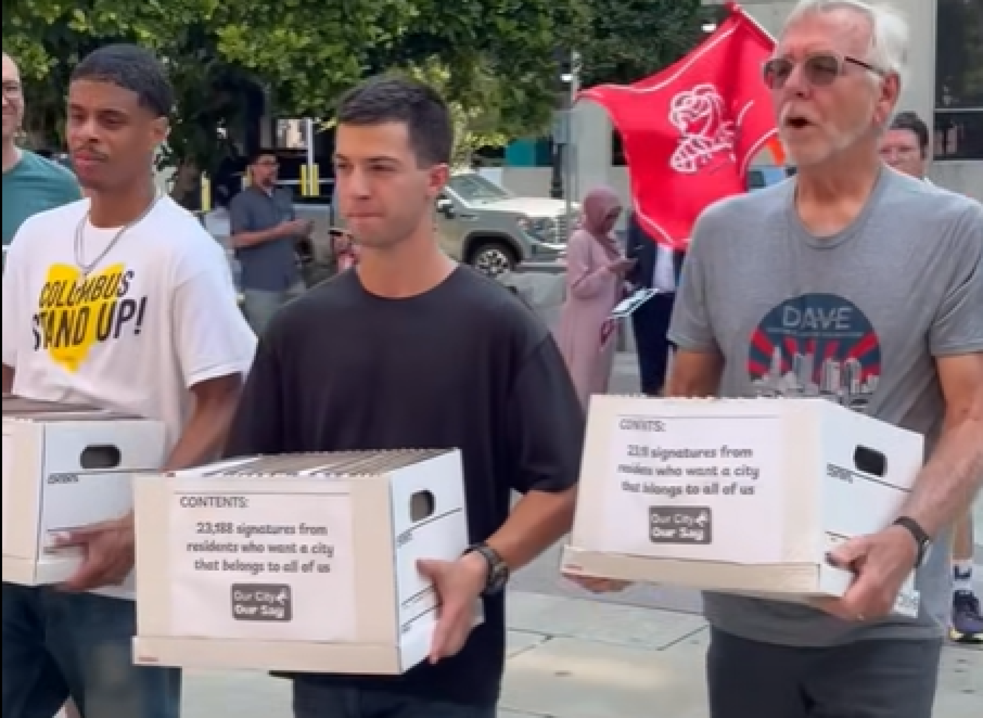People carrying petition boxes