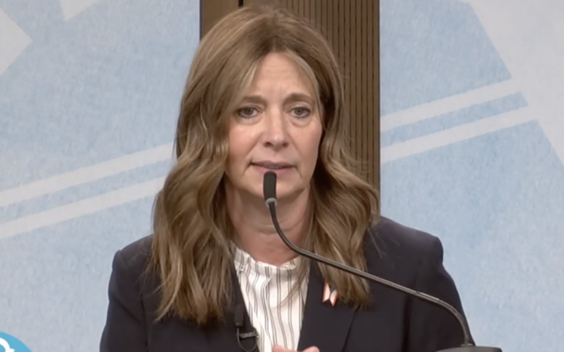 Amy Action at a podium