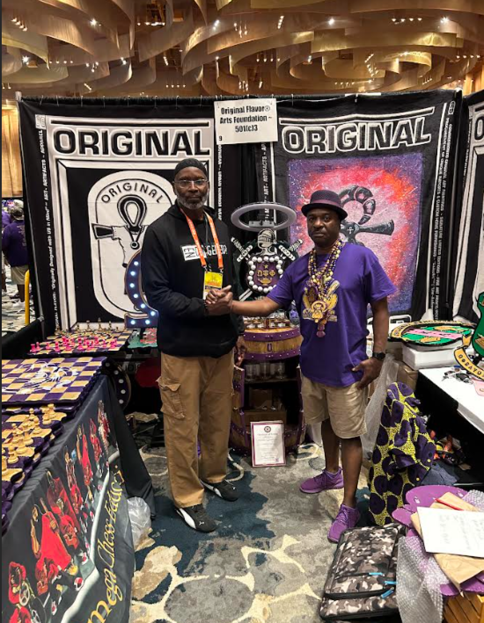 Two men shaking hands at an event